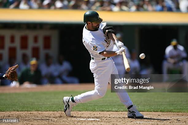 Jason Kendall of the Oakland Athletics bats during the game against the Detroit Tigers at the McAfee Coliseum in Oakland, California on July 4, 2006....