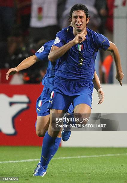 Italian defender Fabio Grosso celebrates his goal in extra time during the semi-final World Cup football match between Germany and Italy at...