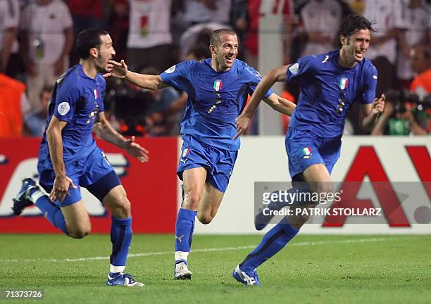 Italian defender Fabio Grosso celebrates his goal in extra time with Italian forward Alessandro Del Piero and Italian defender Gianluca Zambrotta...