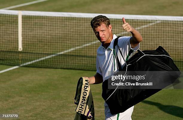 Mark Knowles of Bahamas gives a thumbs up and his team mate Daniel Nestor of Canada celebrate after winning their match against Simon Aspelin of...