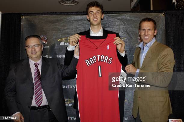 Andrea Bargnani and Team President and General Manager of the Toronto Raptors Bryan Colangelo pose for a portrait during a press conference at Air...