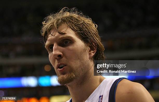 Dirk Nowitzki of the Dallas Mavericks walks off the court after the Mavericks loss to the Miami Heat in game six of the 2006 NBA Finals on June 20,...