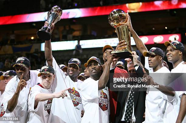 The Miami Heat celebrate as they receive the Larry O'Brien trophy after the Heat defeated the Dallas Mavericks in game six of the 2006 NBA Finals on...