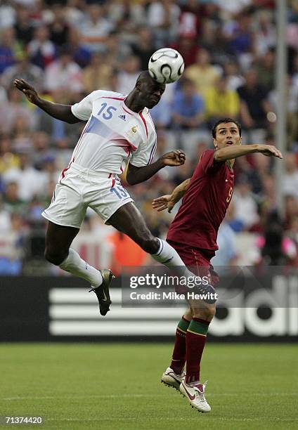 Lilian Thuram of France rises above Pauleta of Portugal, to win a header during the FIFA World Cup Germany 2006 Semi-final match between Portugal and...