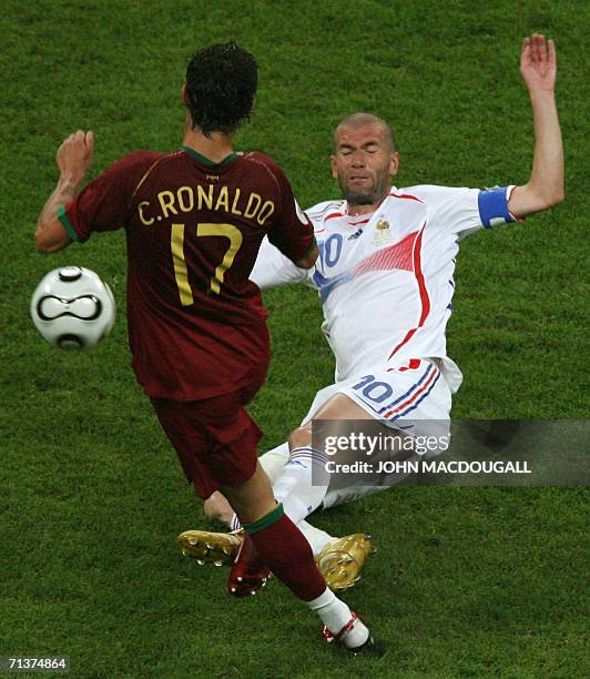 French midfielder Zinedine Zidane tries to tackle Portuguese forward Cristiano Ronaldo during the World Cup semi final football match Portugal vs...