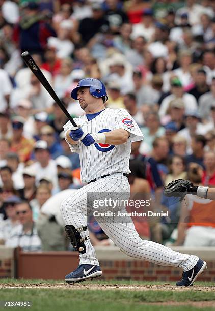 Phil Nevin of the Chicago Cubs makes a hit during the game against the Chicago White Sox on July 1, 2006 at Wrigley Field in Chicago, Illinois.