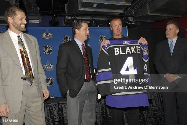 Assistant general manager Ron Hextall, president and general manager Dean Lombardi, veteran defenseman Rob Blake, and head coach Marc Crawford of the...