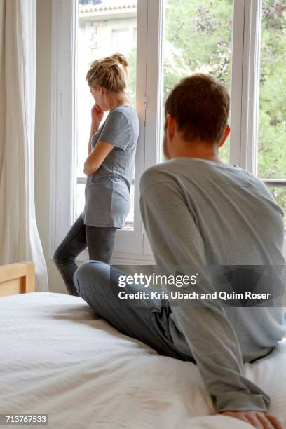mid adult couple in bedroom, having disagreement - fighting stock pictures, royalty-free photos & images