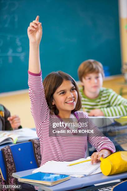 Hand Rasied In Class Girl In Class Raising Hand Photos and Premium High Res Pictures - Getty ...