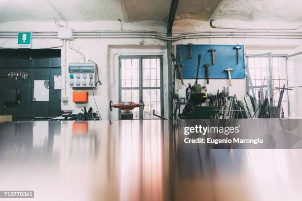 sheet copper on workbench in forge workshop - trestles stock-fotos und bilder