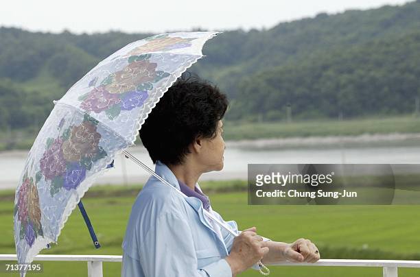 South Korean tourist looks to the North while visiting the border of the demilitarized zone separating North Korea and South Korea on July 6, 2006 in...