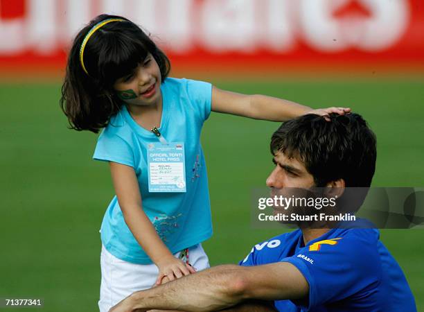 Juninho Pernambucano of Brazil and his daughter during the Brazil National Football Team training session for the FIFA World Cup Germany 2006 at the...