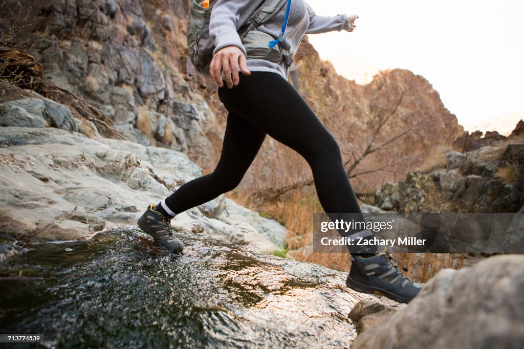 Trekker running in Death Valley National Park, California, US