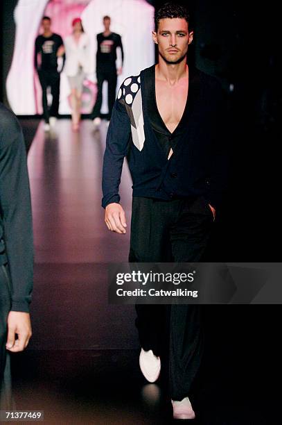 Models walk down the runway at the Emporio Armani show as part of Milan Menswear Spring/Summer 2007 Collections on June 26, 2006 in Milan, Italy.