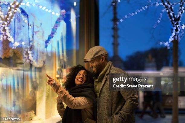 couple window shopping in city at night, new york, usa - new york trip bildbanksfoton och bilder