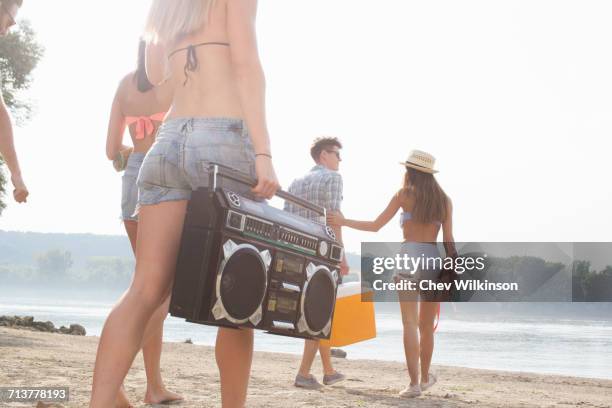 group of friends enjoying beach party - beach music stock pictures, royalty-free photos & images