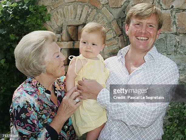 Queen Beatrix of the Netherlands poses with Crown Prince Willem Alexander and Princess Alexia during a photo call in their Italian summer residence...
