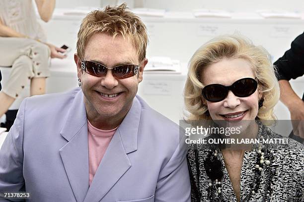 British singer Elton John and Baroness von Brandstetter pose prior German designer Karl Lagerfeld Fall/Winter 2006-07 Haute Couture show for Chanel,...