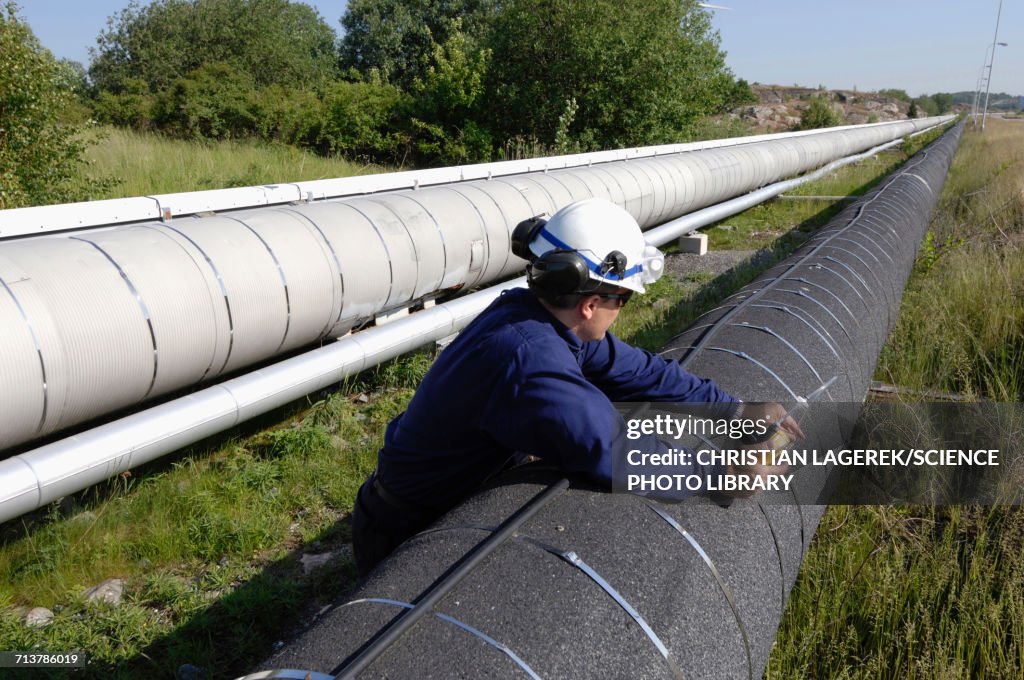 Worker checking gas pipeline