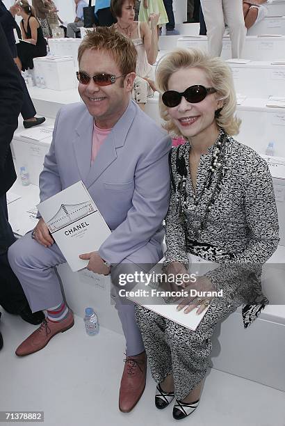 Singer Sir Elton John and Baroness von Brandstetter attend the Chanel Fashion show, during Paris Fashion Week Fall-Winter 2006/07 on July 6, 2006 in...