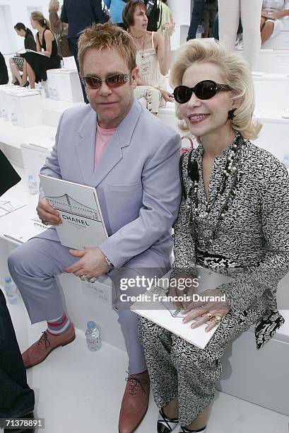 Singer Sir Elton John and Baroness von Brandstetter attend the Chanel Fashion show, during Paris Fashion Week Fall-Winter 2006/07 on July 6, 2006 in...