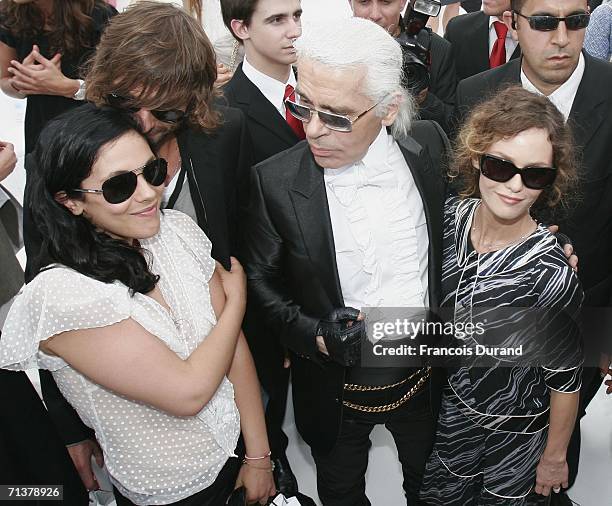 Karl Lagerfeld, Vanessa Paradis and sister Alison attend the Chanel Fashion show, during Paris Fashion Week Fall-Winter 2006/07 on July 6, 2006 in...