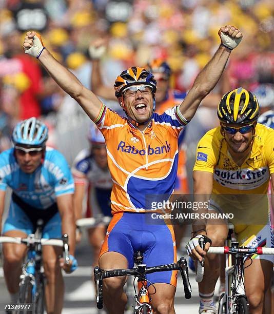 Spain's Oscar Freire celebrates in front of Belgium's Tom Boonen and Germany's Erik Zabel after crossing the finish line of the 225 km fifth stage of...