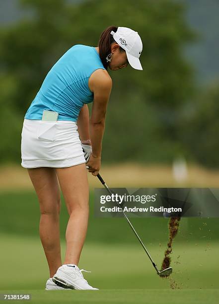 Michelle Wie hits her approach shot on the fourth hole during the first round of the HSBC Women's World Match Play Championship at Hamilton Farm Golf...