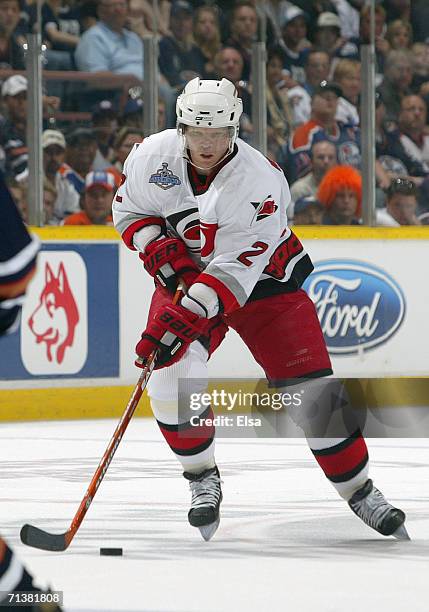 Defenseman Glen Wesley of the Carolina Hurricanes skates the puck into the offensive zone against the Edmonton Oilers during game four of the 2006...