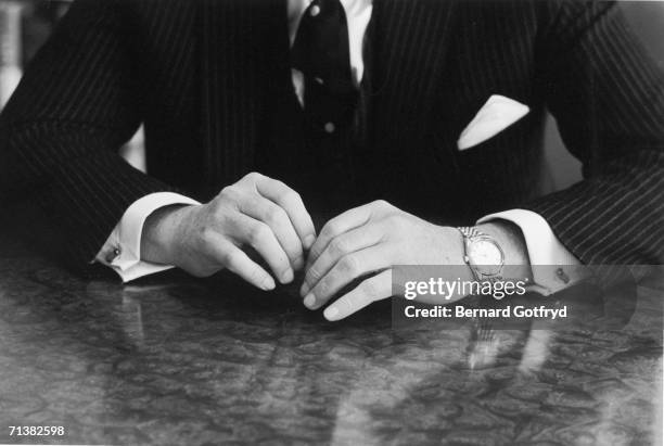 American financier David Rockefeller's hands are seen on a tabletop as he sits for a portrait, 1967.