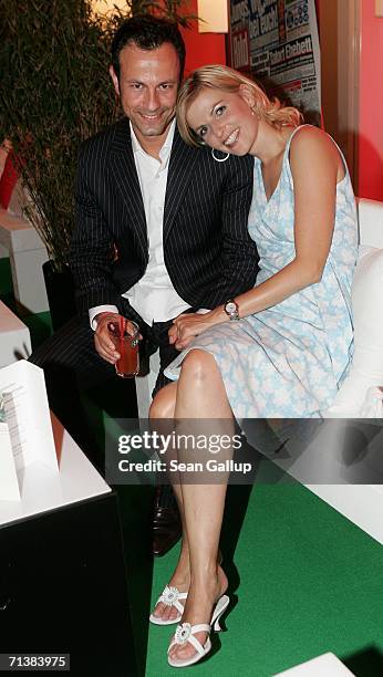 Television hostess Tanja Buelter and friend Moritz Quiske attend the Bild Summer party July 6, 2006 in Berlin, Germany.