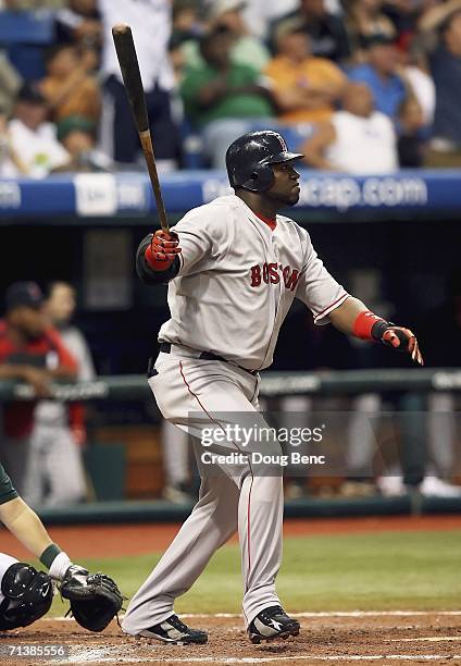 David Ortiz of the Boston Red Sox follows his grand slam home run to left center field in the 9th inning against the Tampa Bay Devil Rays at...