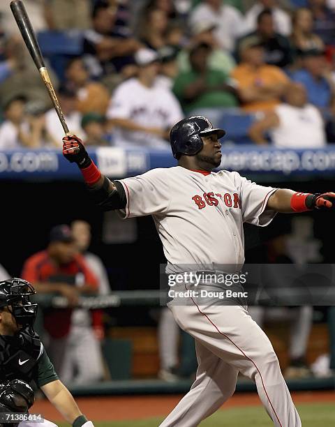 David Ortiz of the Boston Red Sox follows his grand slam home run to left center field in the 9th inning against the Tampa Bay Devil Rays at...