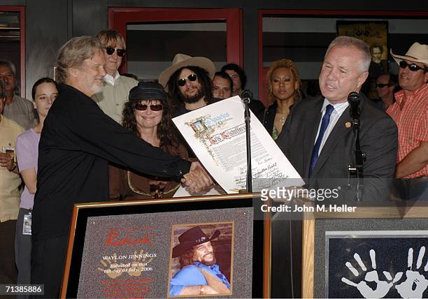 Los Angeles City Council member Tom LaBonge presents proclamations to Kris Kristofferson and Jessi Colter, wife of the late Waylon Jennings, at...