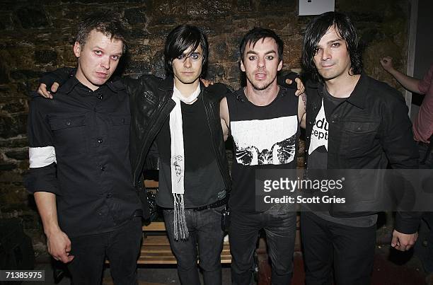 Matt Wachter, actor Jared Leto, Shannon Leto, and Tomo Milicivitch of the group "30 Seconds To Mars" pose for a photo backstage during a taping of...