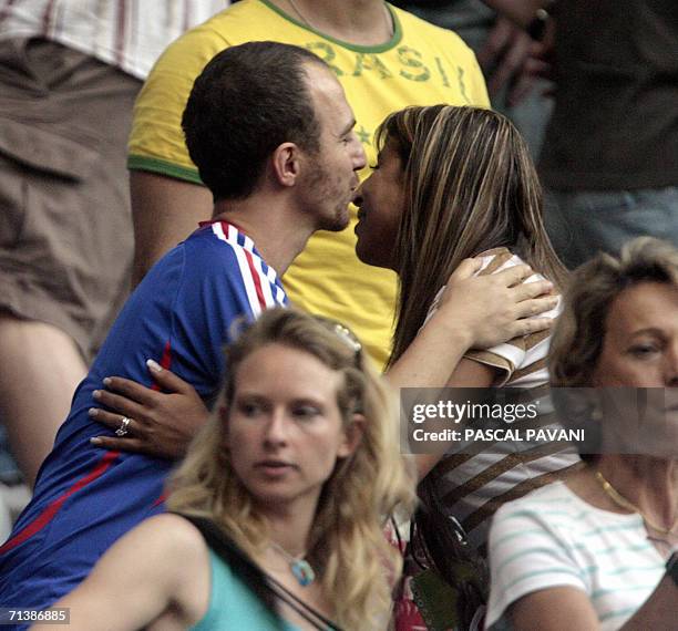 French singer Calogero is pictured with Wahiba Ribery , the wife of French forward Franck Ribery during the semi-final 2006 World Cup football game...