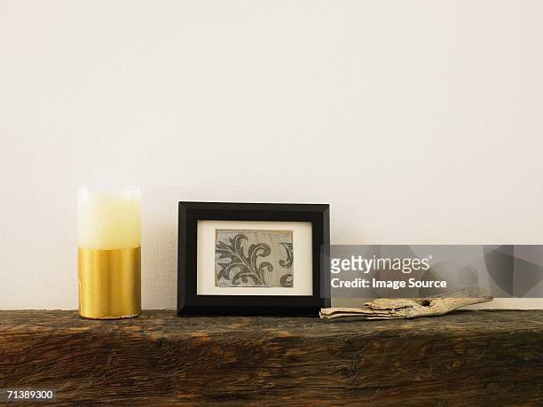 objects on a mantelpiece - photo frame on mantle piece stock pictures, royalty-free photos & images
