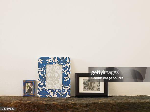 frames on a mantelpiece - photo frame on mantle piece stock pictures, royalty-free photos & images