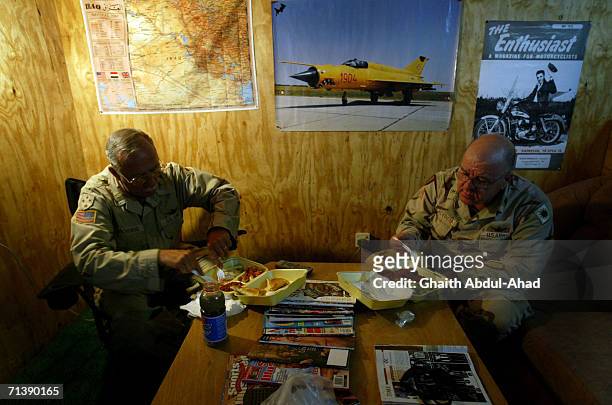 Army pilots CW5 DeWayne Browning and CW3 Randy Weatherhead veterans of the Vietnam war have dinner in there room on June 12, 2005 in FOB Speicher,...