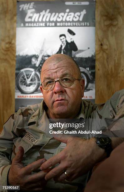 Army pilot CW3 Randy Weatherhead veterans of the Vietnam war poses for a photo in his room on June 12, 2005 in FOB Speicher, Iraq.