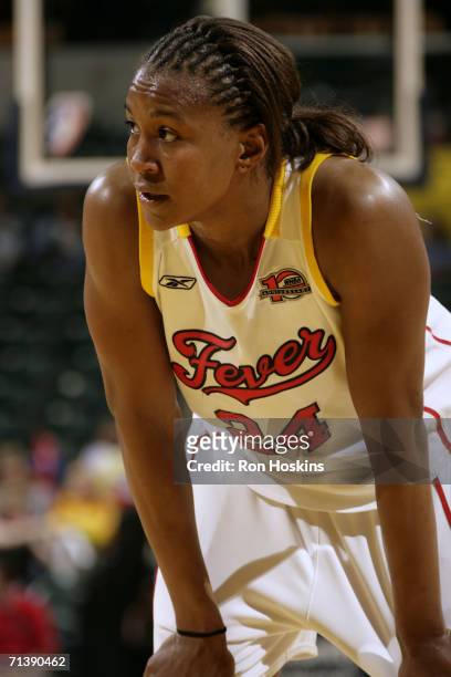 Tamika Catchings of the Indiana Fever rests during the game against the Seattle Storm on June 11, 2006 at Conseco Fieldhouse in Indianapolis,...