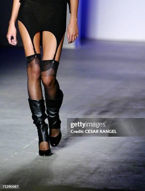 Model wears boots and a garter belt in Spanish Gori de Palma's Spring-Summer 2007 collection during Barcelona Pasarela in Barcelona 07 July 2006. AFP...