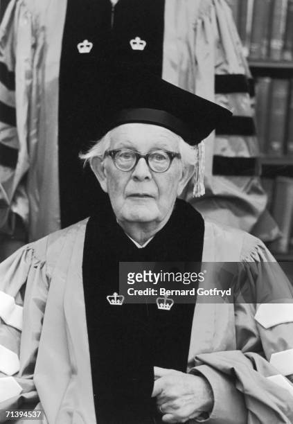 Swiss psychologist Jean Piaget wears academic robes and poses for a photograph as he recieves an honorary degree from Columbia University, Spring...