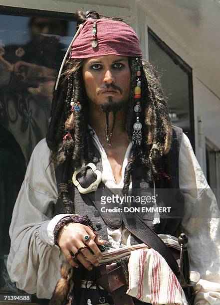 New York, UNITED STATES: A wax figure of Johnny Depp as Captain Jack Sparrow from Madame Tussauds stands on the deck of Circle Line X as she docks 07...