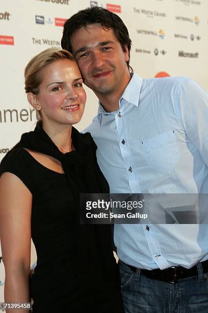 Actor Andreas Elsholz and actress Denise Zich attend the ZDF television station summer party July 7, 2006 in Berlin, Germany.