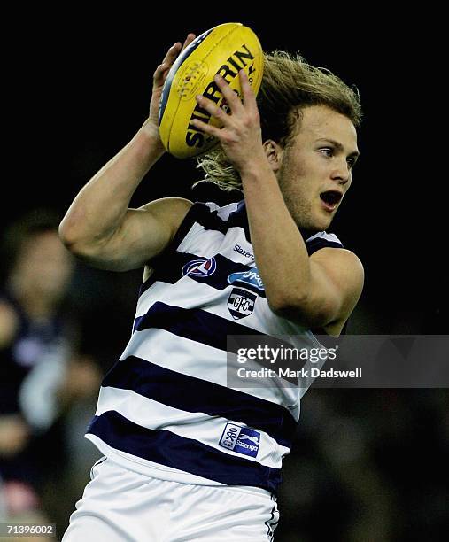 Gary Ablett of the Cats gathers the balll during the round 14 AFL match between the Carlton Blues and Geelong Cats at Telstra Dome July 8, 2006 in...