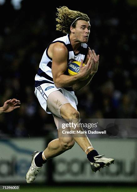 Cameron Mooney of the Cats marks during the round 14 AFL match between the Carlton Blues and Geelong Cats at Telstra Dome July 8, 2006 in Melbourne,...