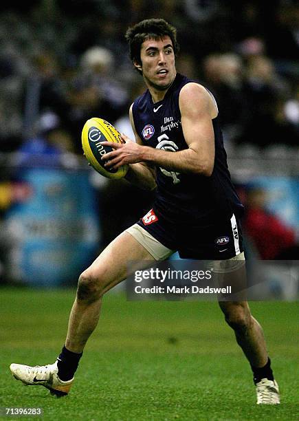 Kade Simpson of the Blues looks for a teammate during the round 14 AFL match between the Carlton Blues and Geelong Cats at Telstra Dome July 8, 2006...