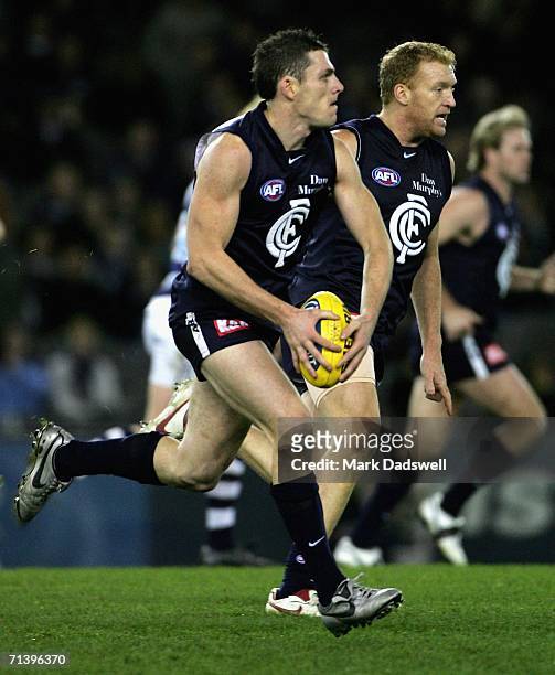 Heath Scotland of the Blues looks for a teammate during the round 14 AFL match between the Carlton Blues and Geelong Cats at Telstra Dome July 8,...