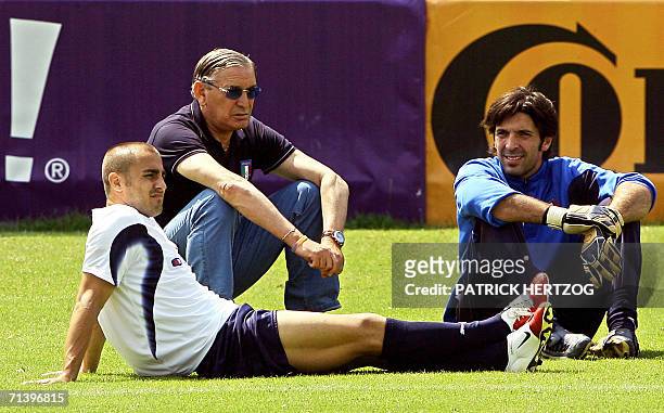 Italian captain Fabio Cannavaro, team manager Gigi Riva and goalkeeper Gianluigi Buffon are seen during a training session, 08 July 2006 in Duisburg,...